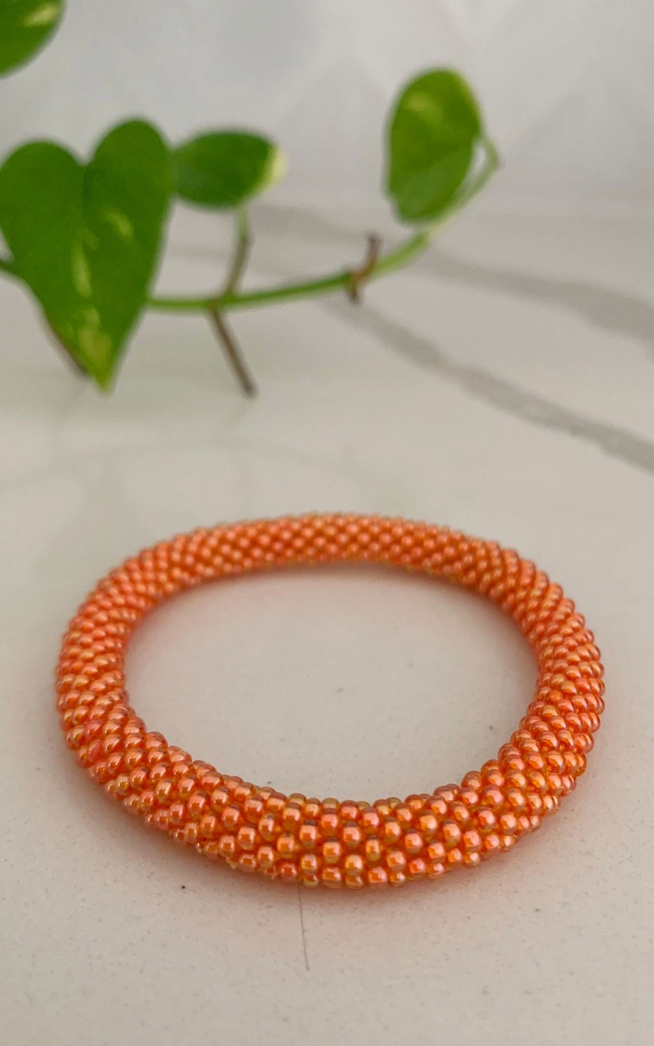 Orange store bead bracelet